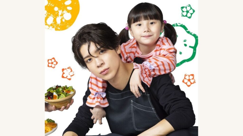 小さな女の子をおんぶしている松島聡